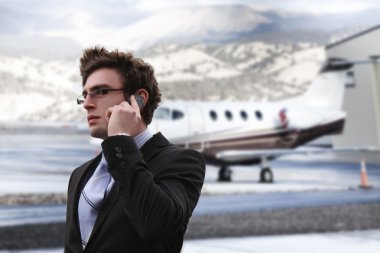 Businessman in the airport clipart