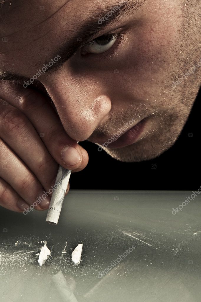 Young man sniffing cocaine. Stock Photo by ©nelka7812 2980174