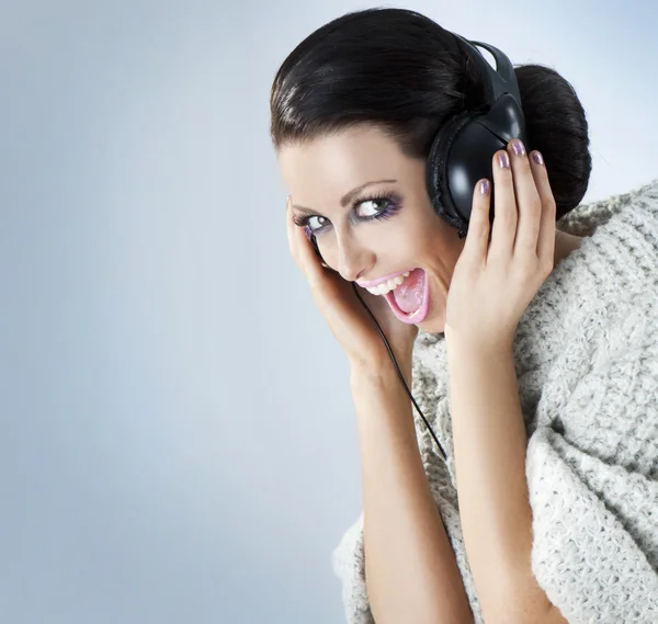 A girl in headphones — Stock Photo, Image