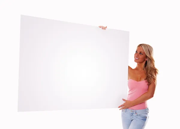 Sexy girl holding a billboard — Stock Photo, Image