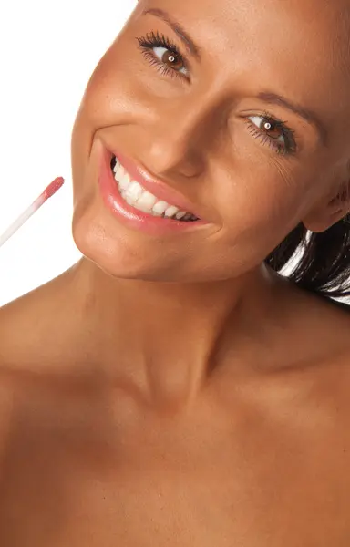 Applying pink lip gloss — Stock Photo, Image