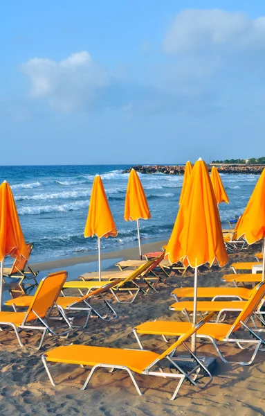 Stock image Sunbeds and beach umbrellas