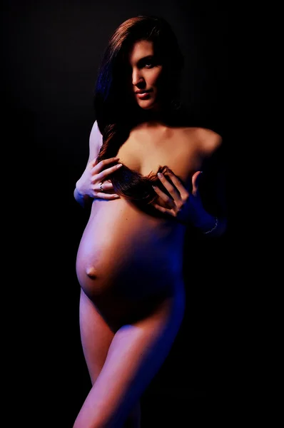 Голая беременная девушка — стоковое фото