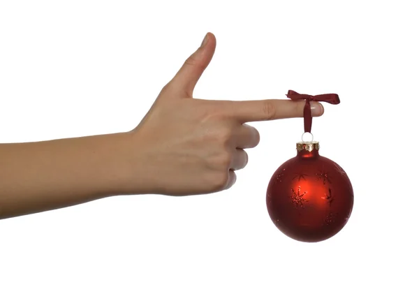 Noel oyuncak asılı ile el — Stok fotoğraf