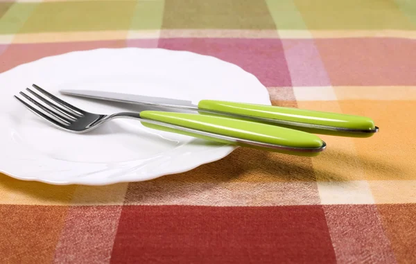 Plate with knife and fork on the table — Stock Photo, Image