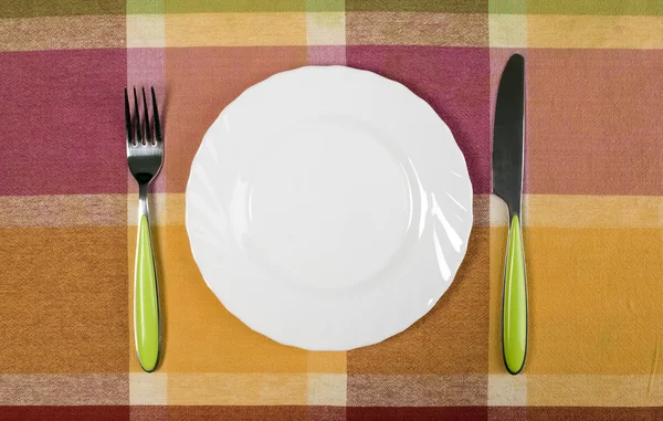 Plate with knife and fork on the table — Stock Photo, Image