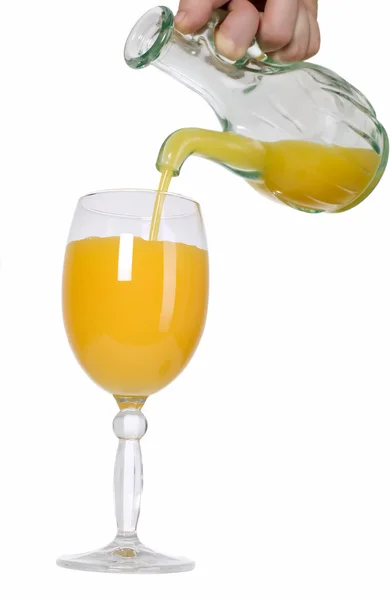 Man is pouring orange juice — Stock Photo, Image