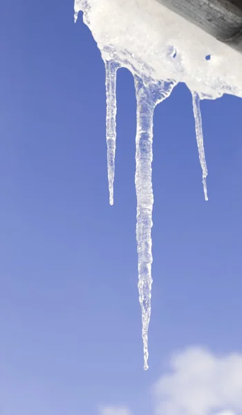 Icicles frame on cloudy sky background — Stock Photo, Image