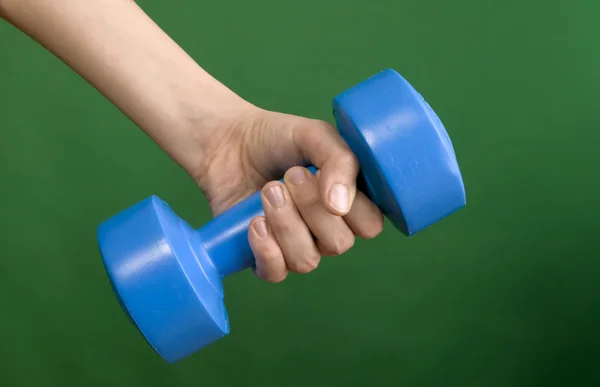 Human hand and dumbbell — Stock Photo, Image