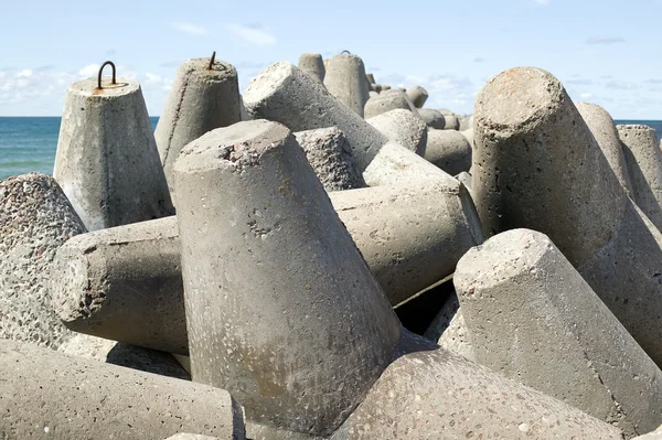 stock image Huge stone with sea in background