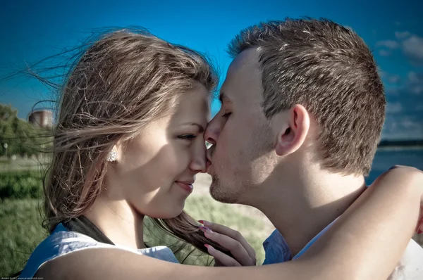 stock image Young beautiful couple kissing