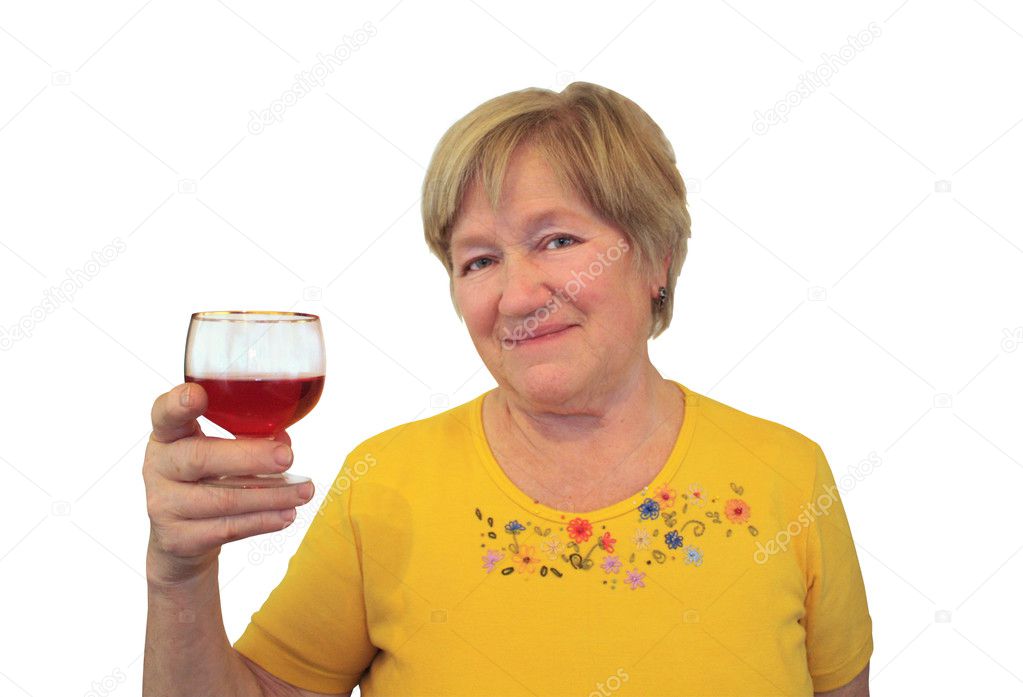 Elderly woman raised a glass of wine