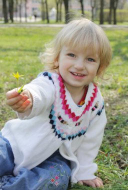 A little girl gives a flower clipart