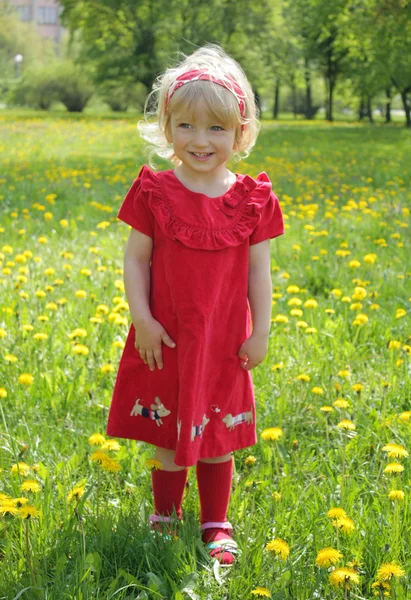 Little girl in a red dress for a walk — Stock Photo, Image