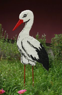 Foam stork on the lawn clipart