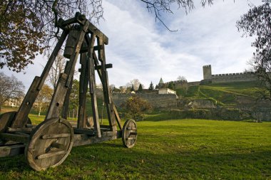 Catapult under city wall clipart