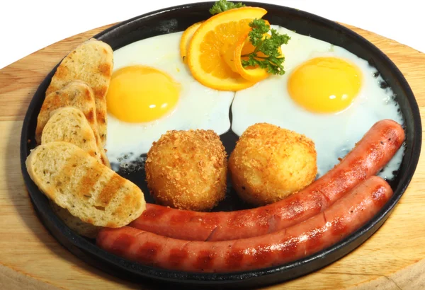 stock image Smiling fried eggs with sausages