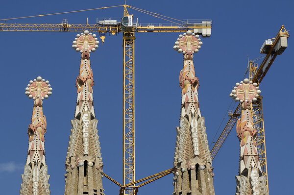 Artistic Tower of Sagrada Familia with crane