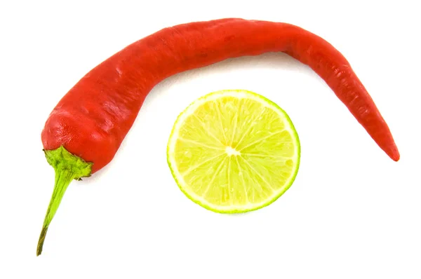 Cayenne and lime on white bacground — Stock Photo, Image