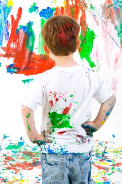 Child painting on wall clipart