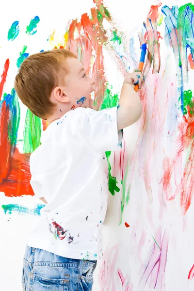 Child painting on wall — Stock Photo, Image