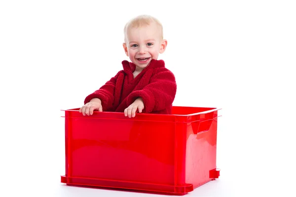 Hraje v červený plastový box — Stock fotografie