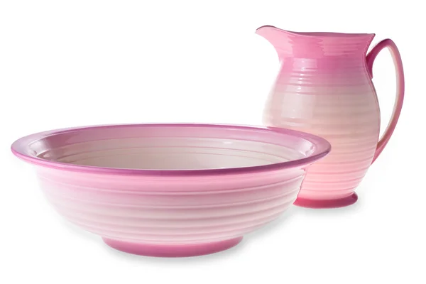 孤立的粉红色粘土水罐和碗 图库照片