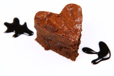 Heart shaped brownie pierced by an arrow clipart