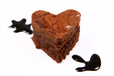 Heart shaped brownie pierced by an arrow clipart