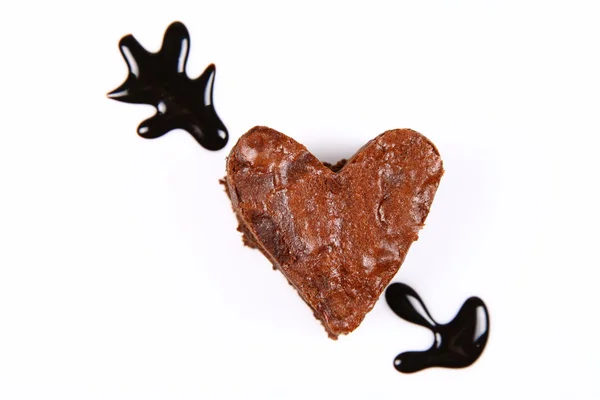 Pierced heart shaped brownie — Stock Photo, Image