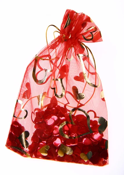 Bag with heart shaped confetti — Stockfoto