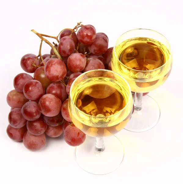 Two glasses of white wine and grapes — Stock Photo, Image