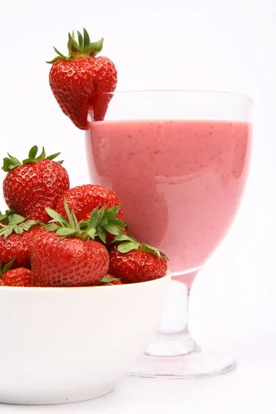 Strawberries in a bowl and a strawberry shake — Stock Photo, Image