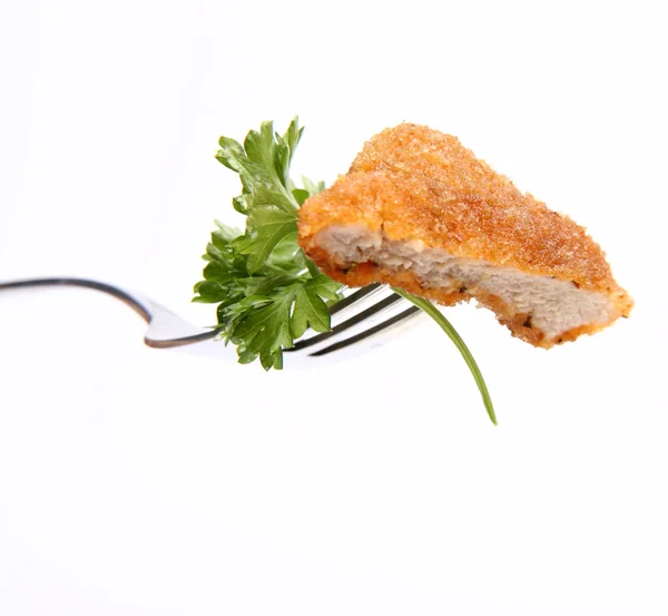 Piece of pork chop on a fork — Stock Photo, Image