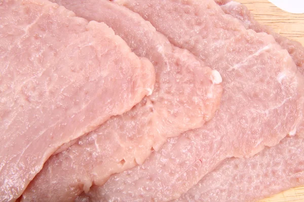 Chuletas de cerdo crudas ablandadas —  Fotos de Stock