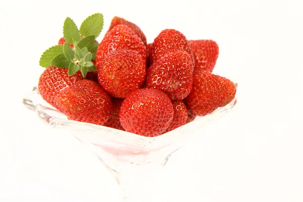 Strawberries & lemon balm twig — Stock Photo, Image