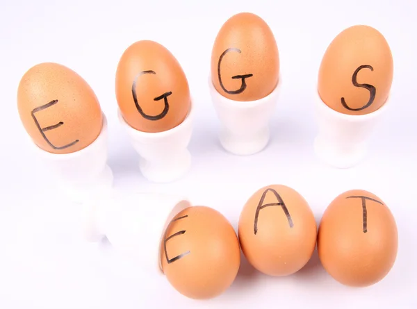 Eggs with an inscription EAT EGGS — Stock Photo, Image