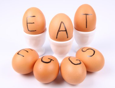 Eggs with an inscription EAT EGGS clipart