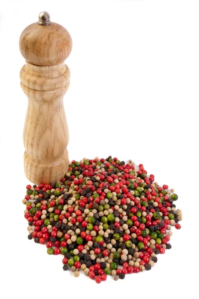 Pepper mill and peppercorns — Stock Photo, Image