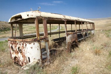 Old bus on the meadow clipart