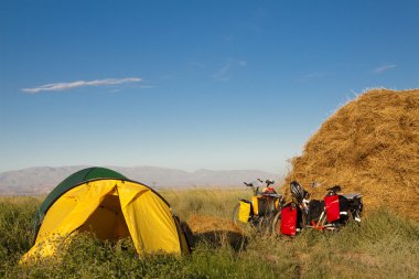 Two tent and two bicycles clipart