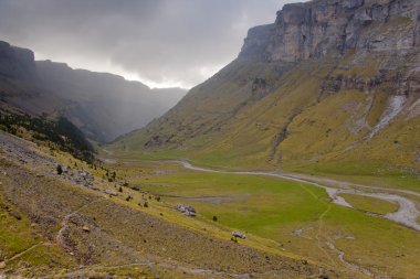 Ordesa valley - dark cloudy day. clipart