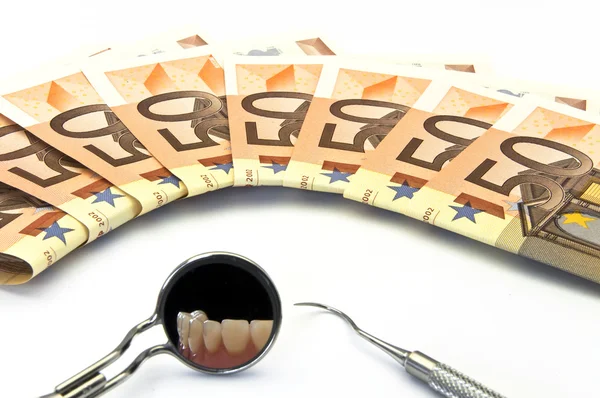 Peníze a zubní péče — Stock fotografie