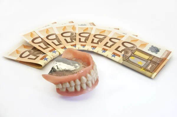 Denaro e dentiera — Foto Stock