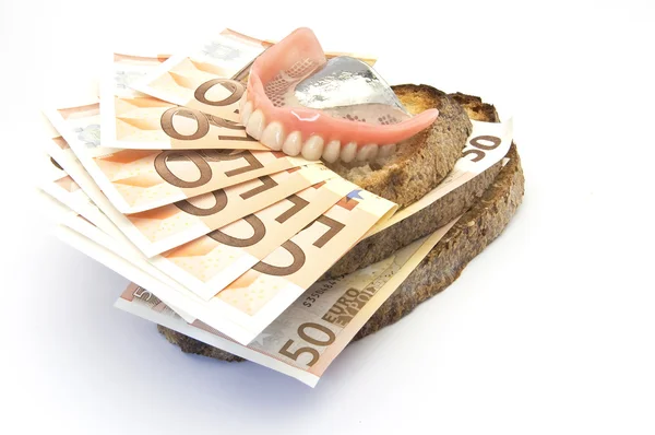 Pão e dinheiro — Fotografia de Stock
