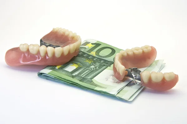 Dentaduras e dinheiro — Fotografia de Stock