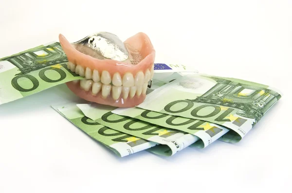 Zubní protézy a peníze Stock Snímky