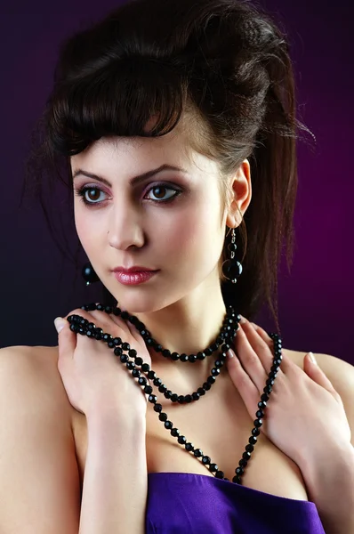 Lady with black beads — Stock Photo, Image