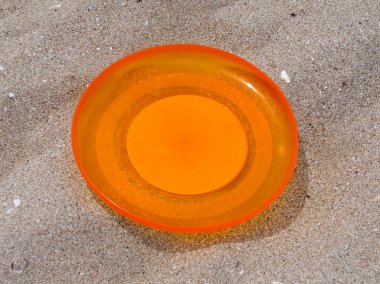 Frisbee in sand clipart