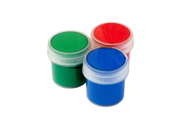Três frascos fechados RGB com guache colorido — Fotografia de Stock